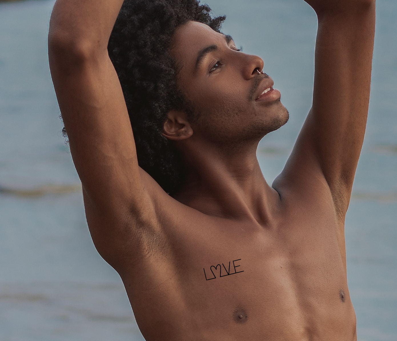 love tattoo on chest