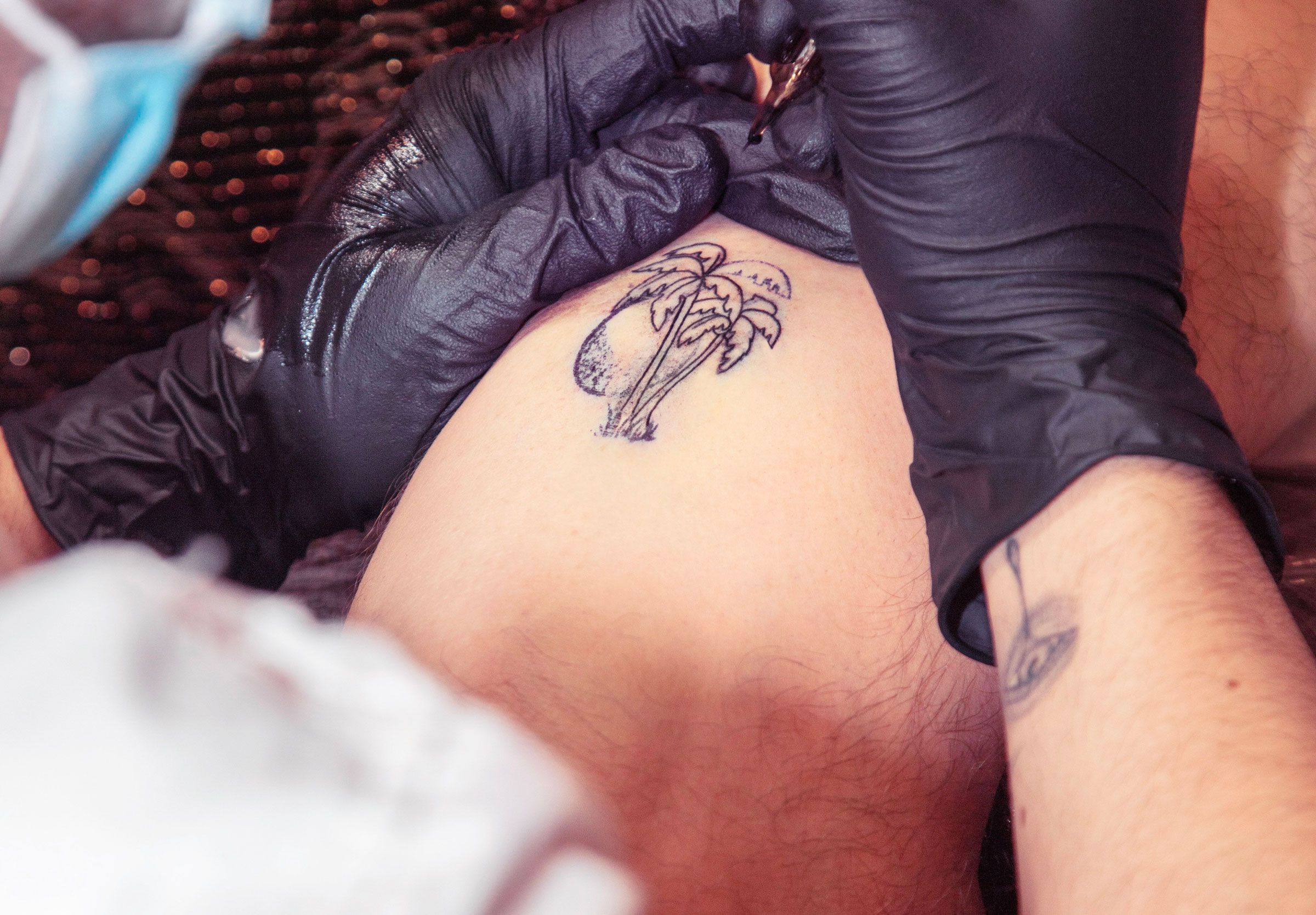 Ephemeral tattoo studio artist giving a temporary tattoo