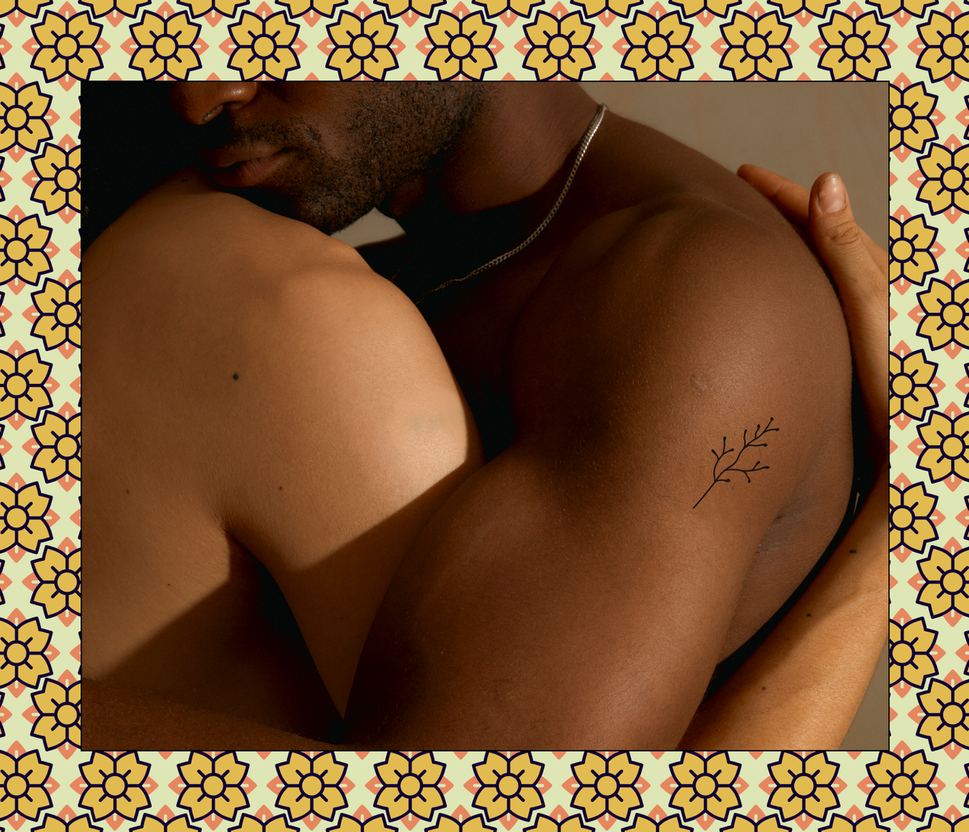 floral tattoo on side of shoulder