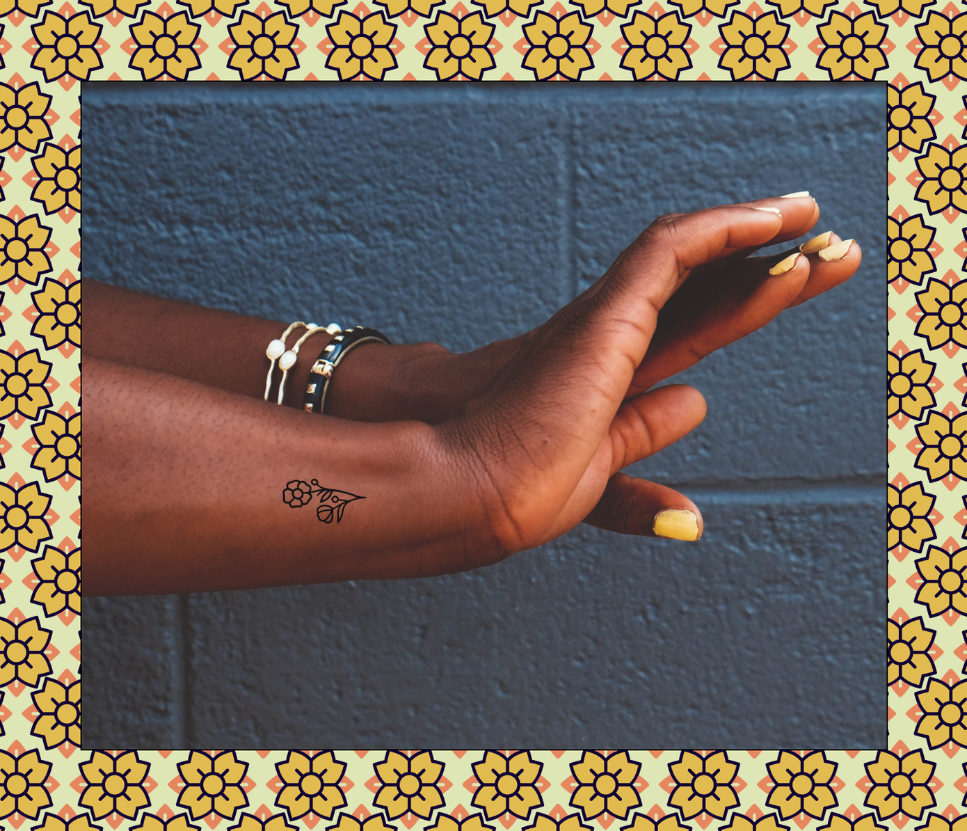 tiny flower tattoo on wrist