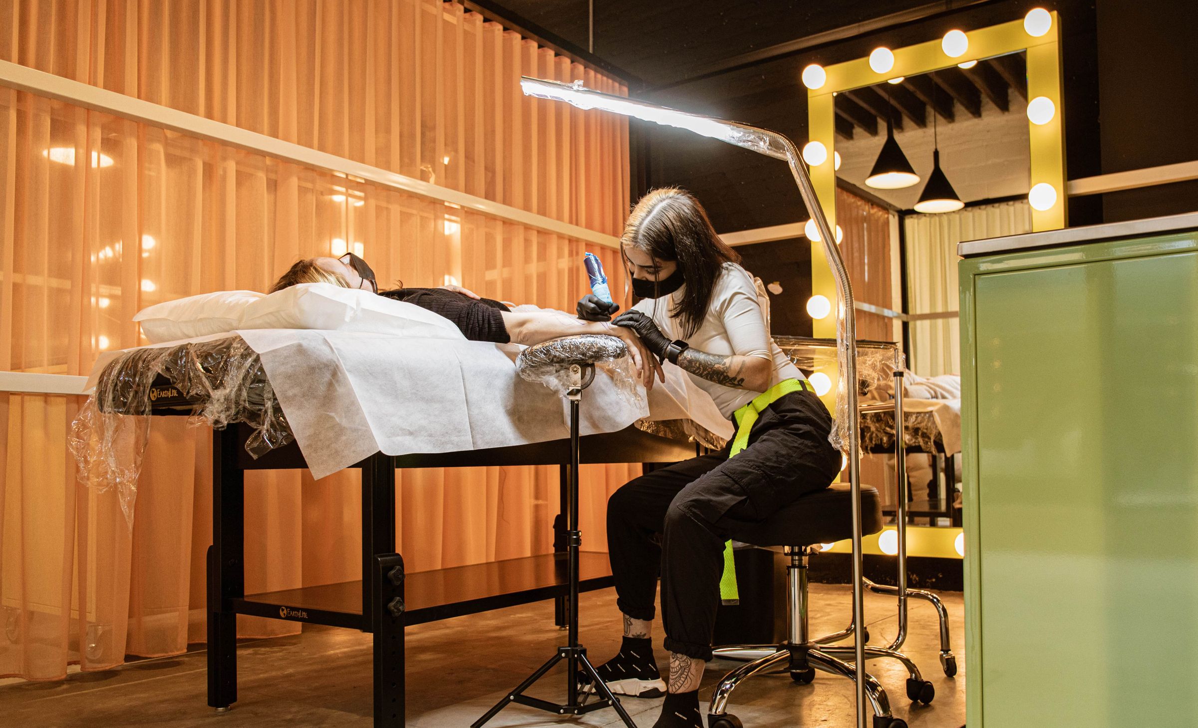 Ephemeral tattoo studio artist giving a temporary tattoo