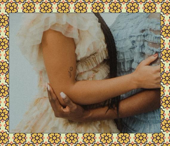 fine line tulip flower tattoo on arm