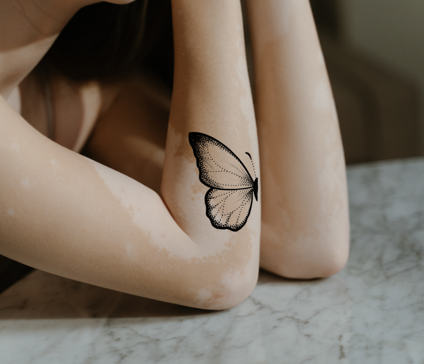 butterfly tattoo on arm