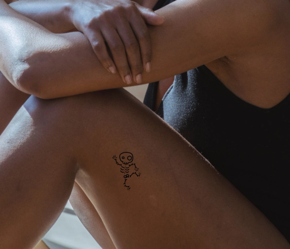 skeleton tattoo on leg