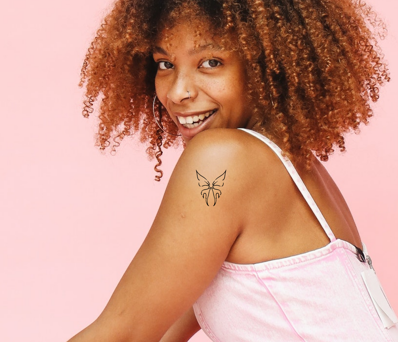 wings tattoo on arm