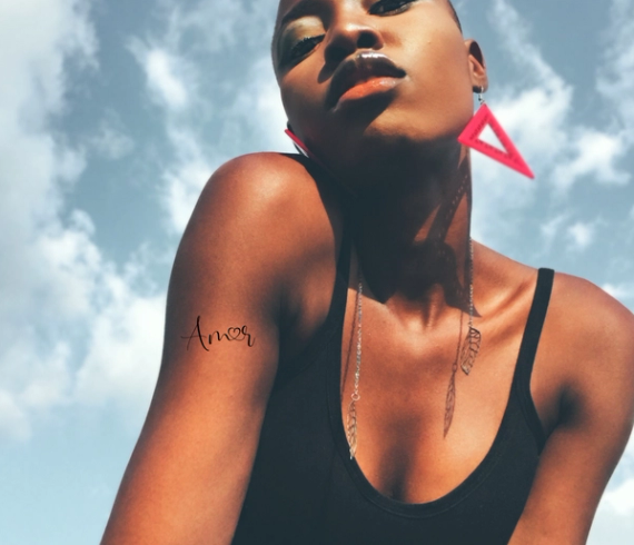 amor tattoo on arm
