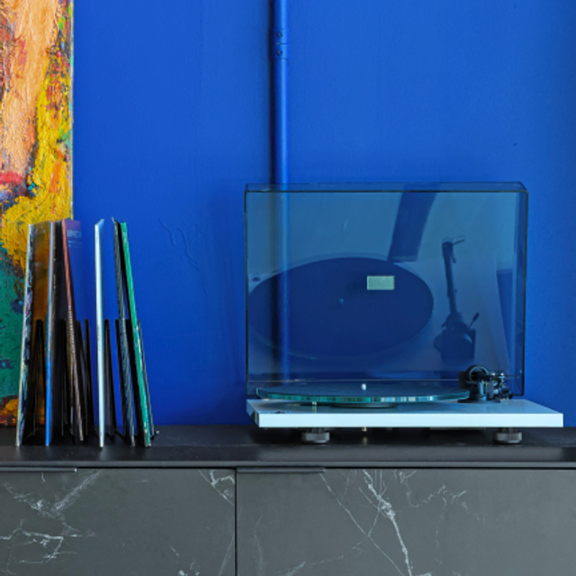 record player against blue wall