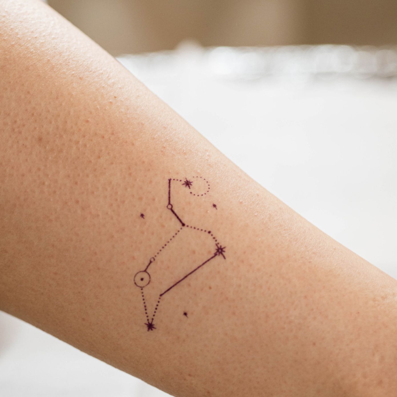 ephemeral tattoo artist drawing custom tattoo