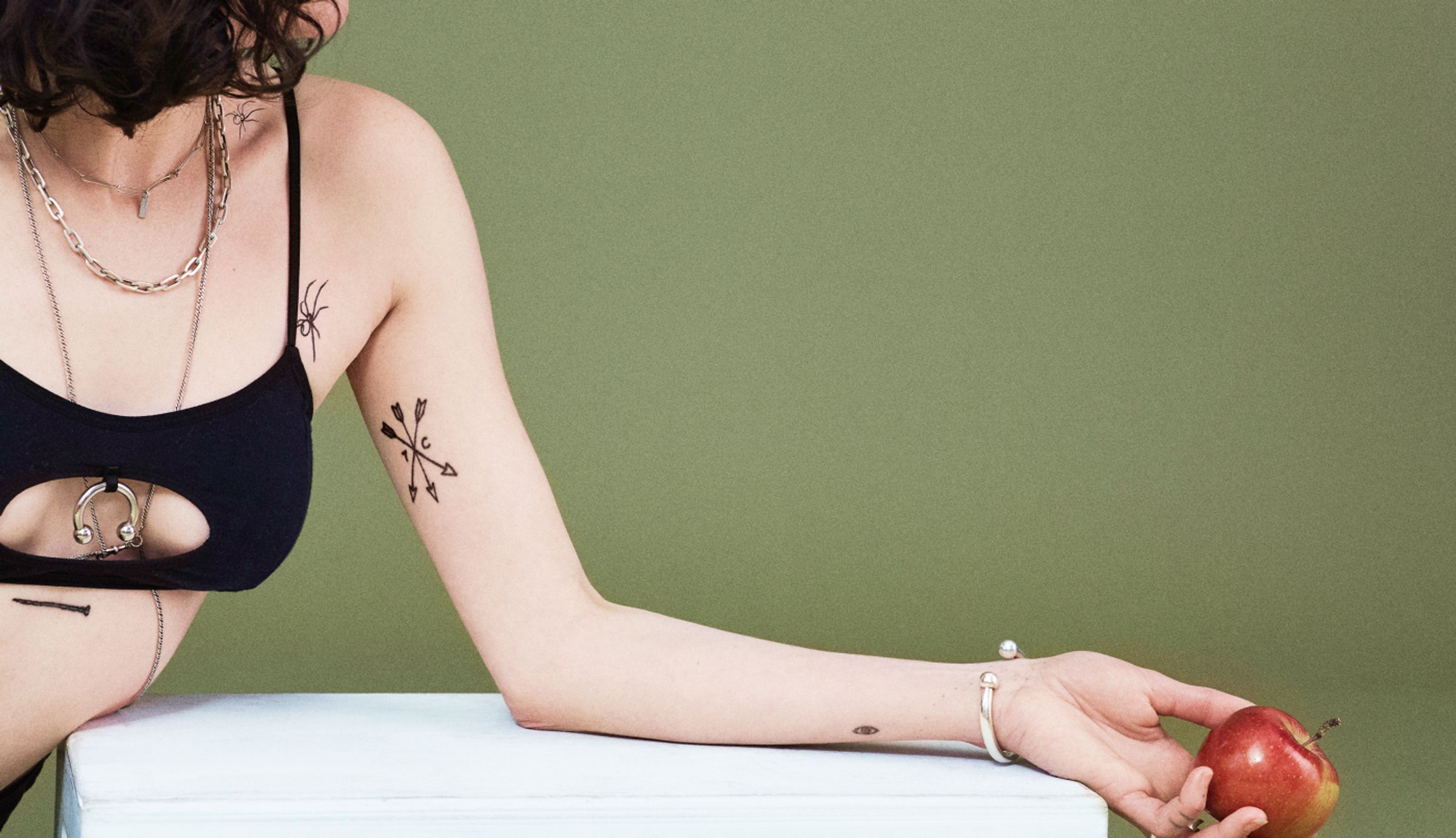 girl with temporary and permanent line tattoos