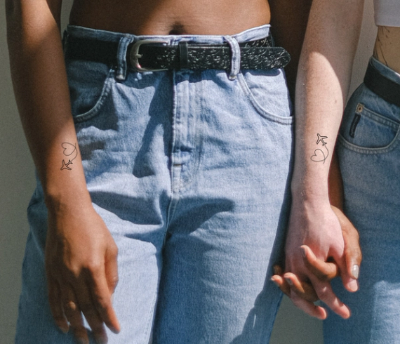 matching airplane travel tattoos