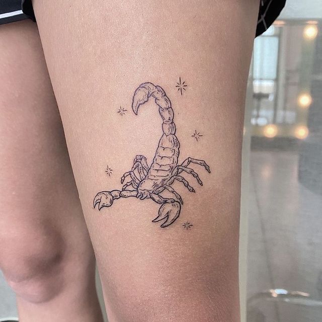 scorpion on leg tattoo