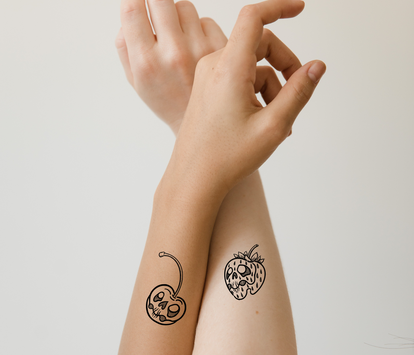 cherry and strawberry matching spooky tattoos