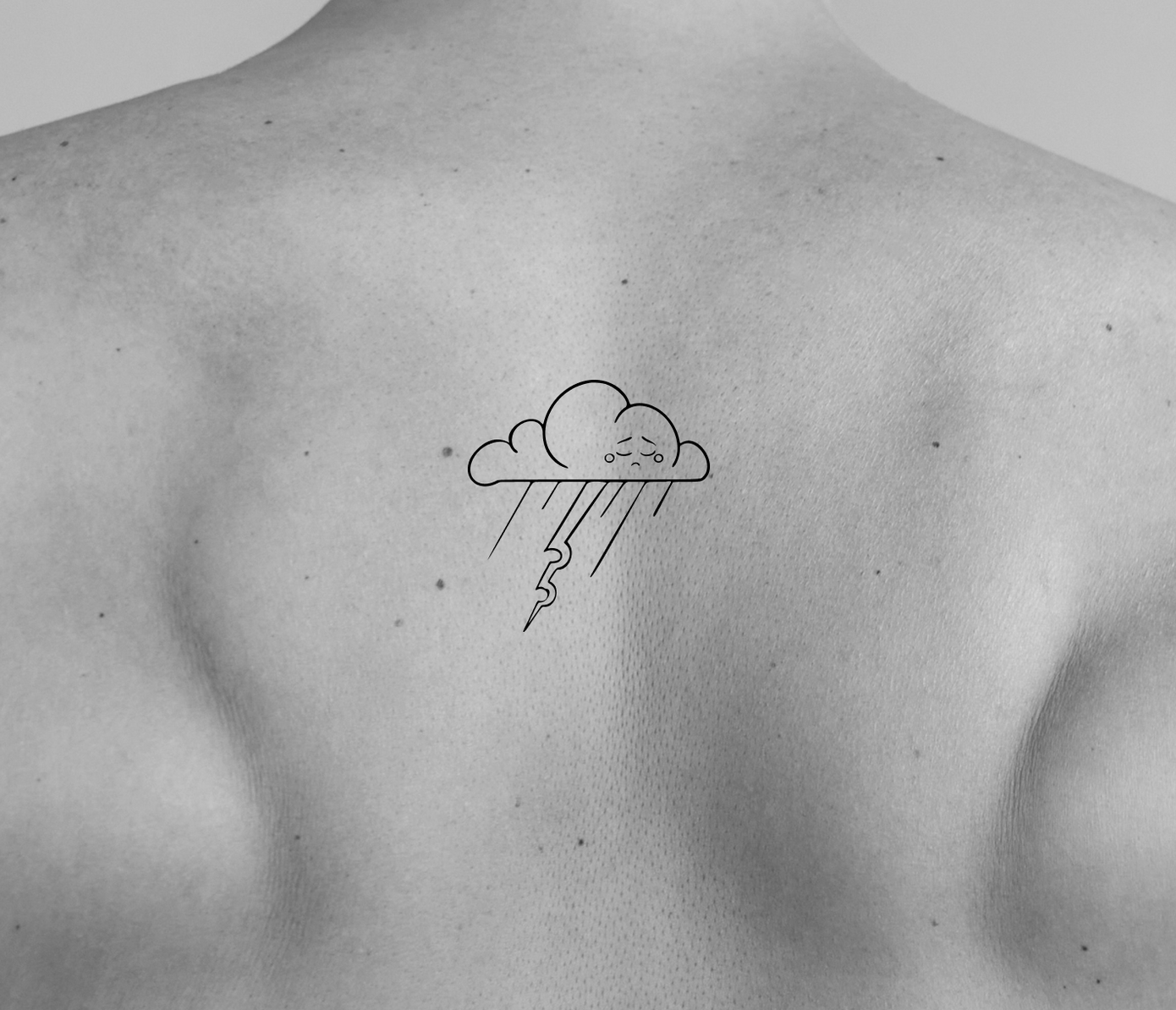 cloud tattoo on back