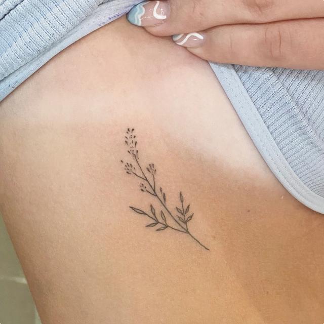 tiny flower line tattoo ephemeral