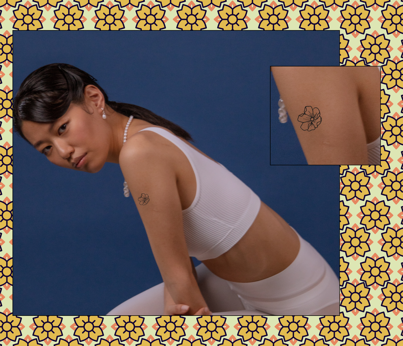 small flower tattoo on shoulder
