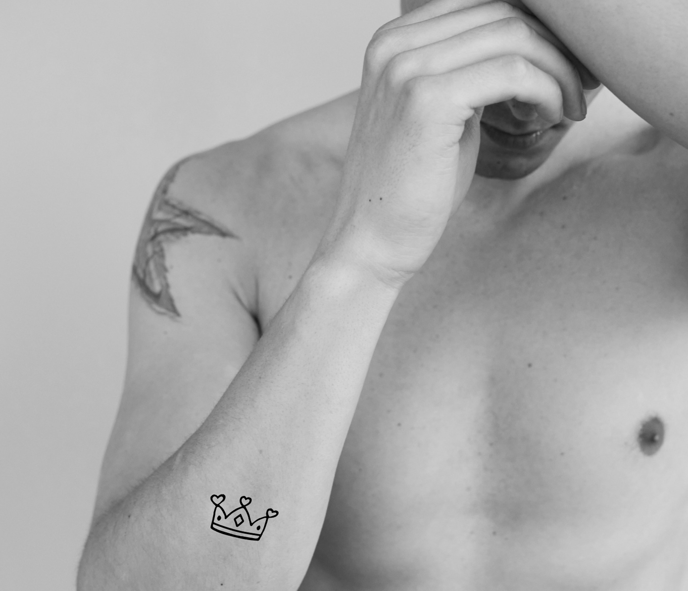 crown tattoo on arm