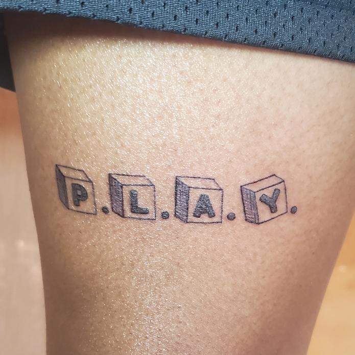 custom word font tattoo design for men with black ink