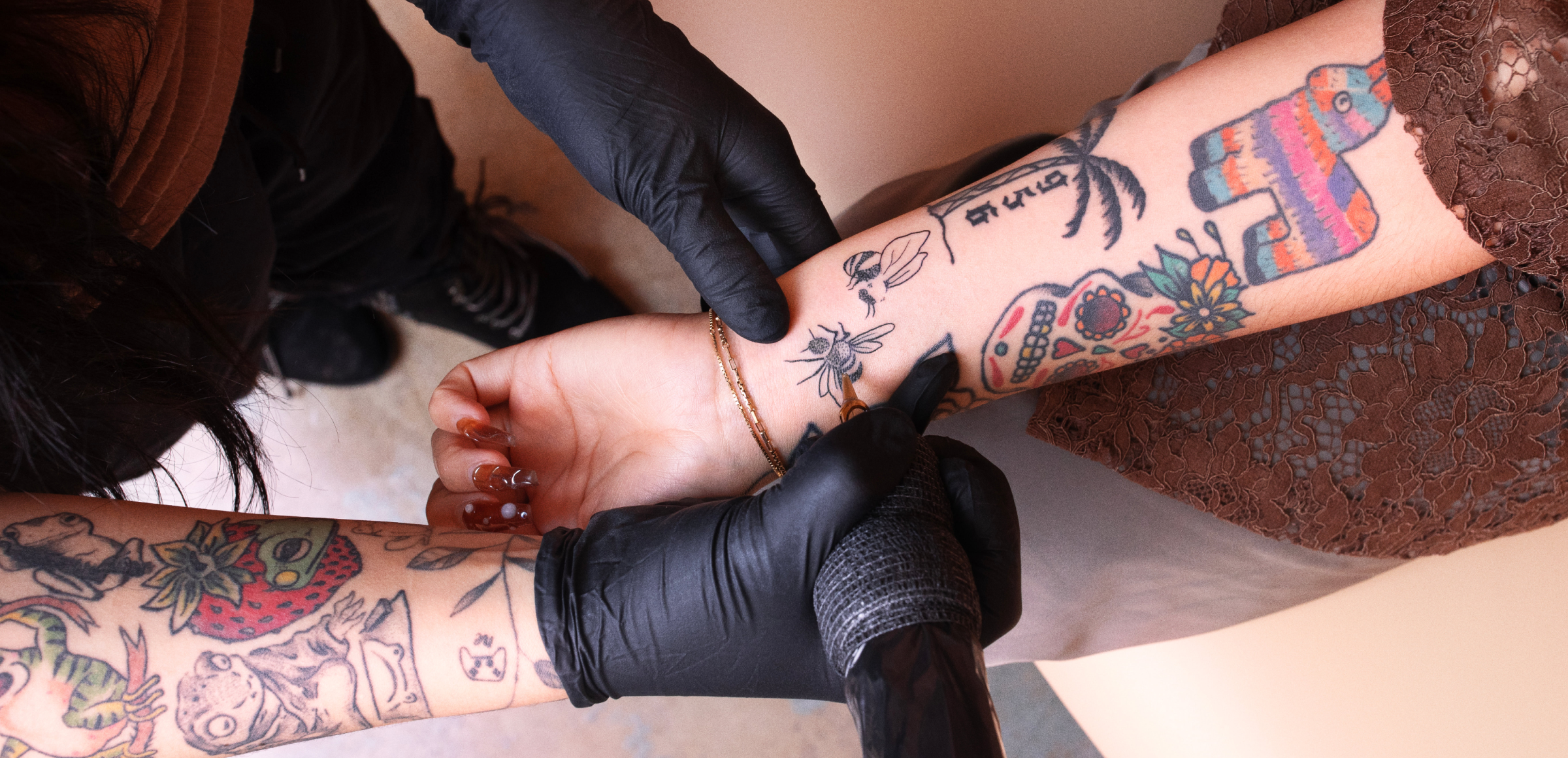 person getting tattooed at ephemeral studio