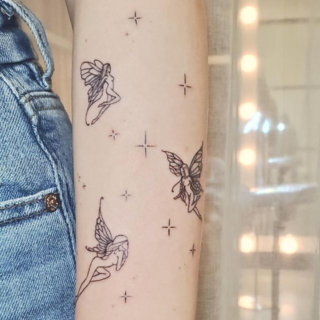 fairies on arm tattoo
