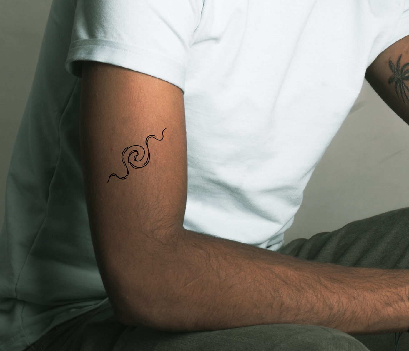 ripple tattoo on arm