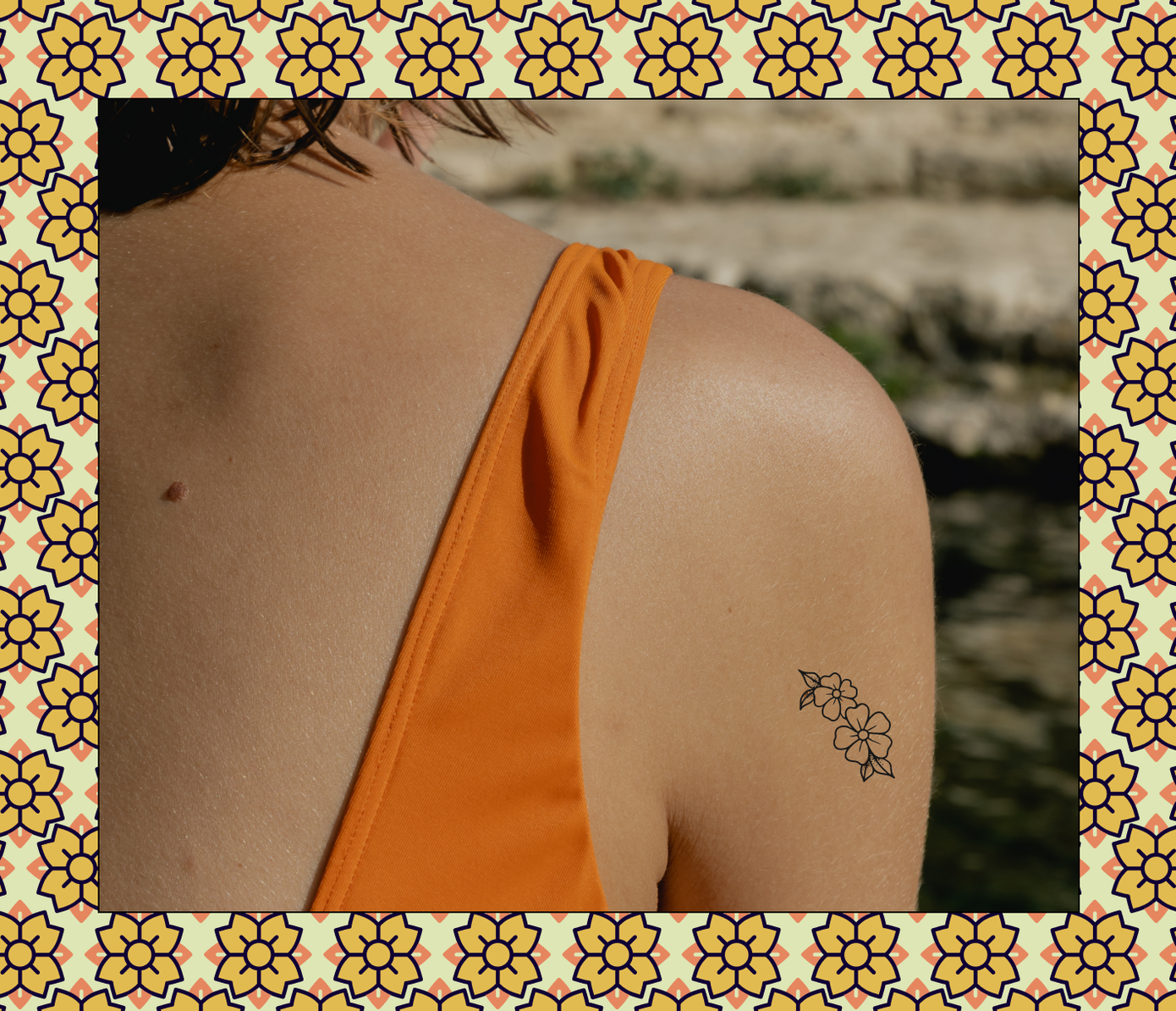 flower tattoo on back of arm