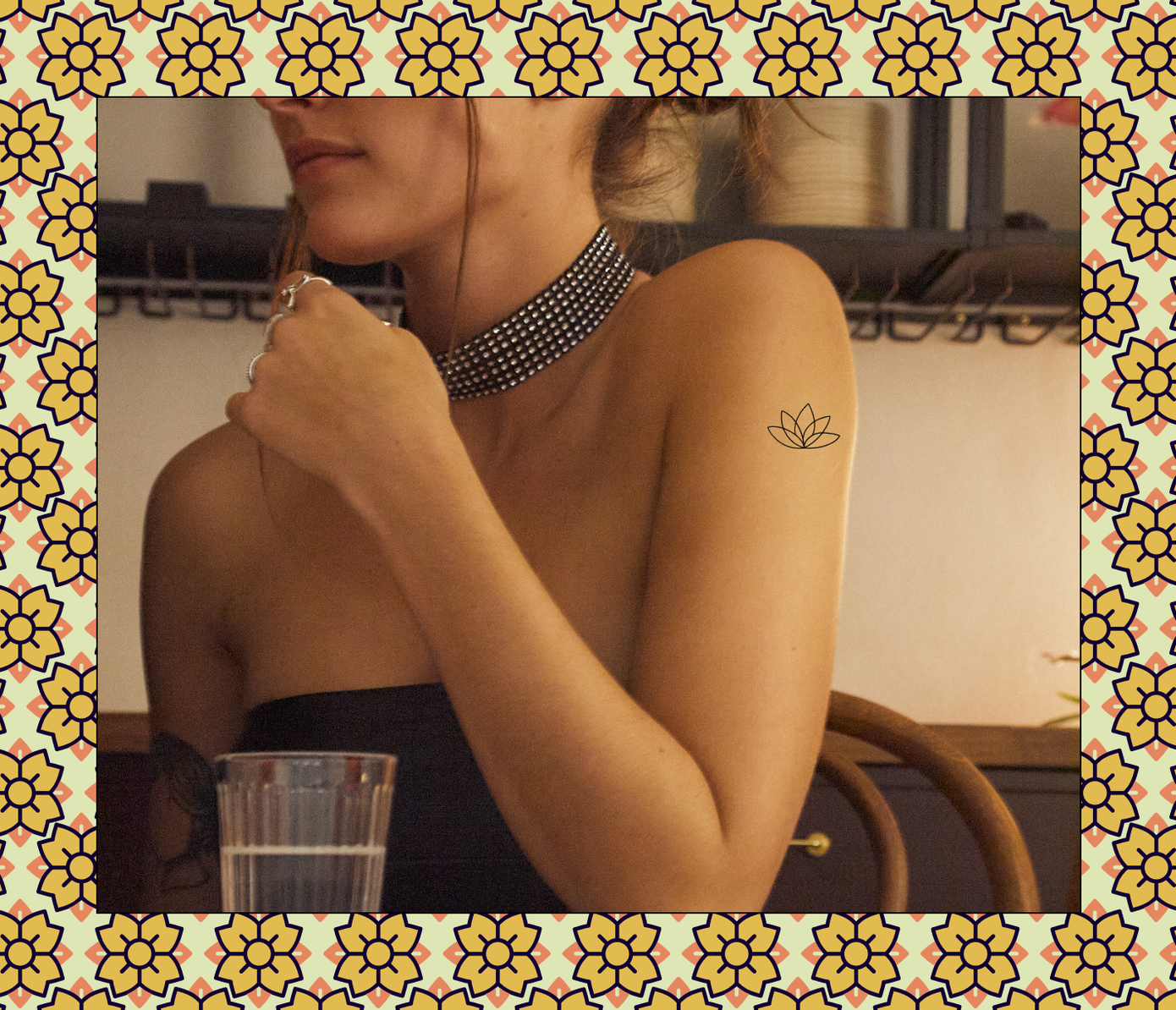 minimalistic flower tattoo on arm