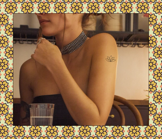 minimalistic flower tattoo on arm