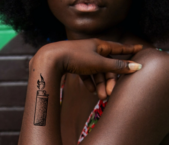 lighter tattoo on wrist
