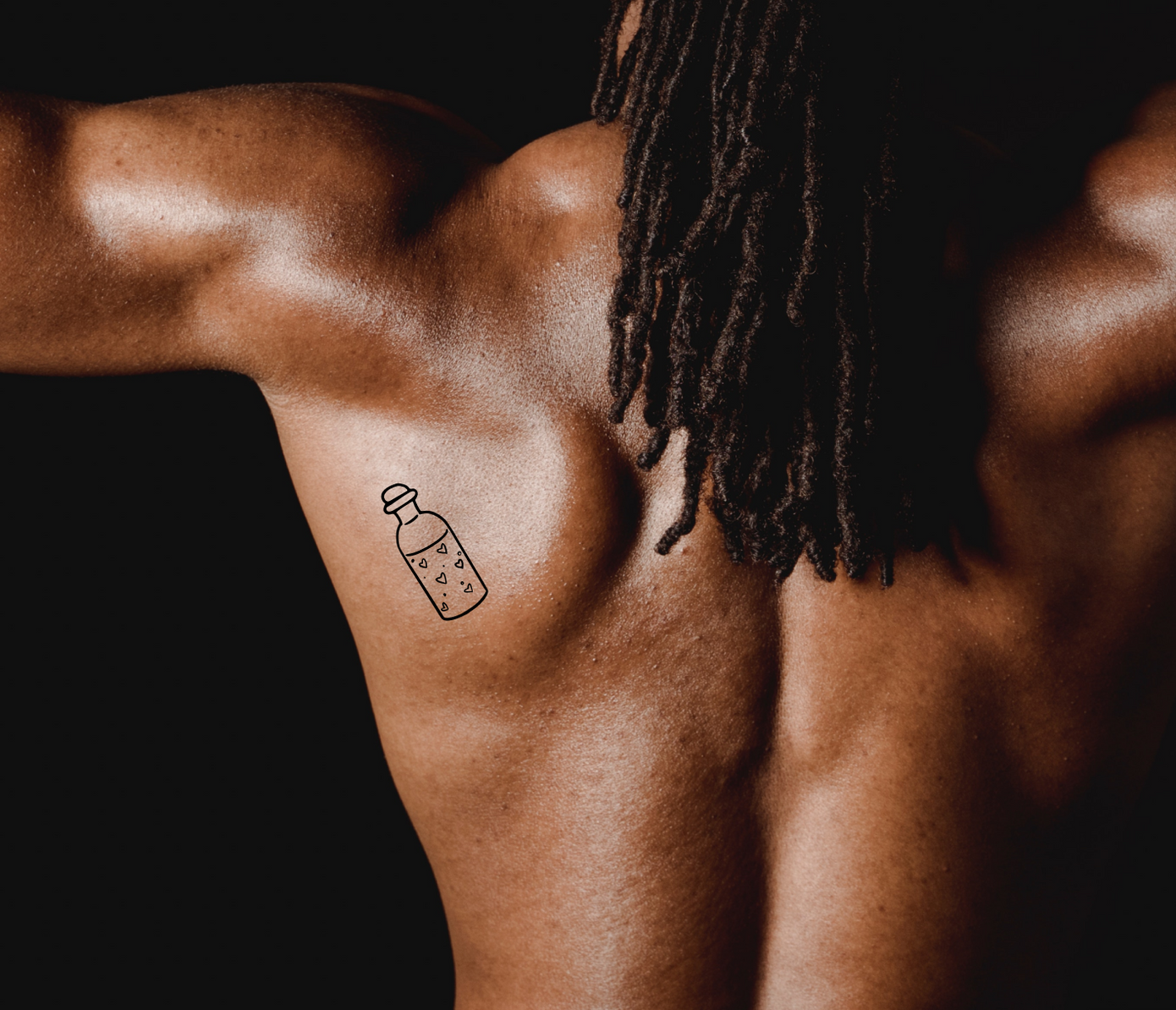 love potion tattoo on shoulder