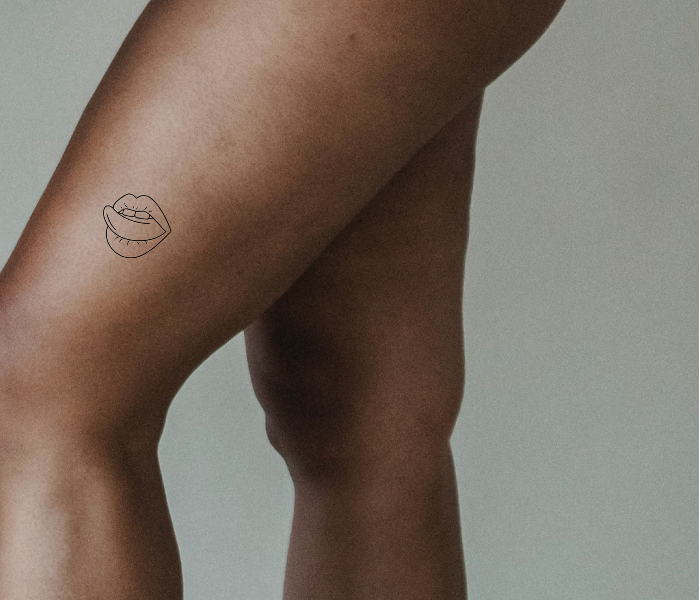 licking lips tattoo on hip