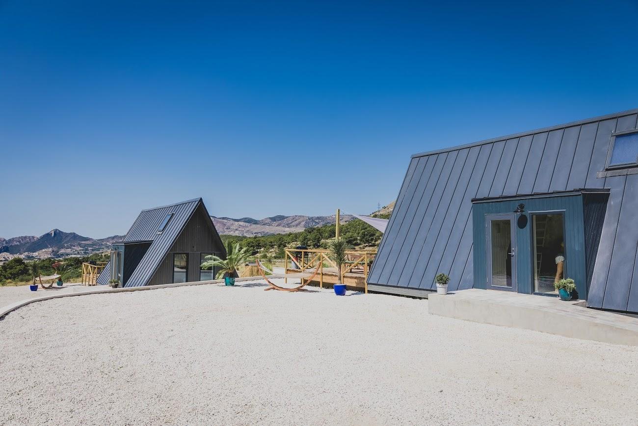 This expansive shot of the Finca Les Coves eco-resort in Spain highlights the modular versatility of the Avrame system when deployed at scale. Here, the "plan" has come together into a full community.