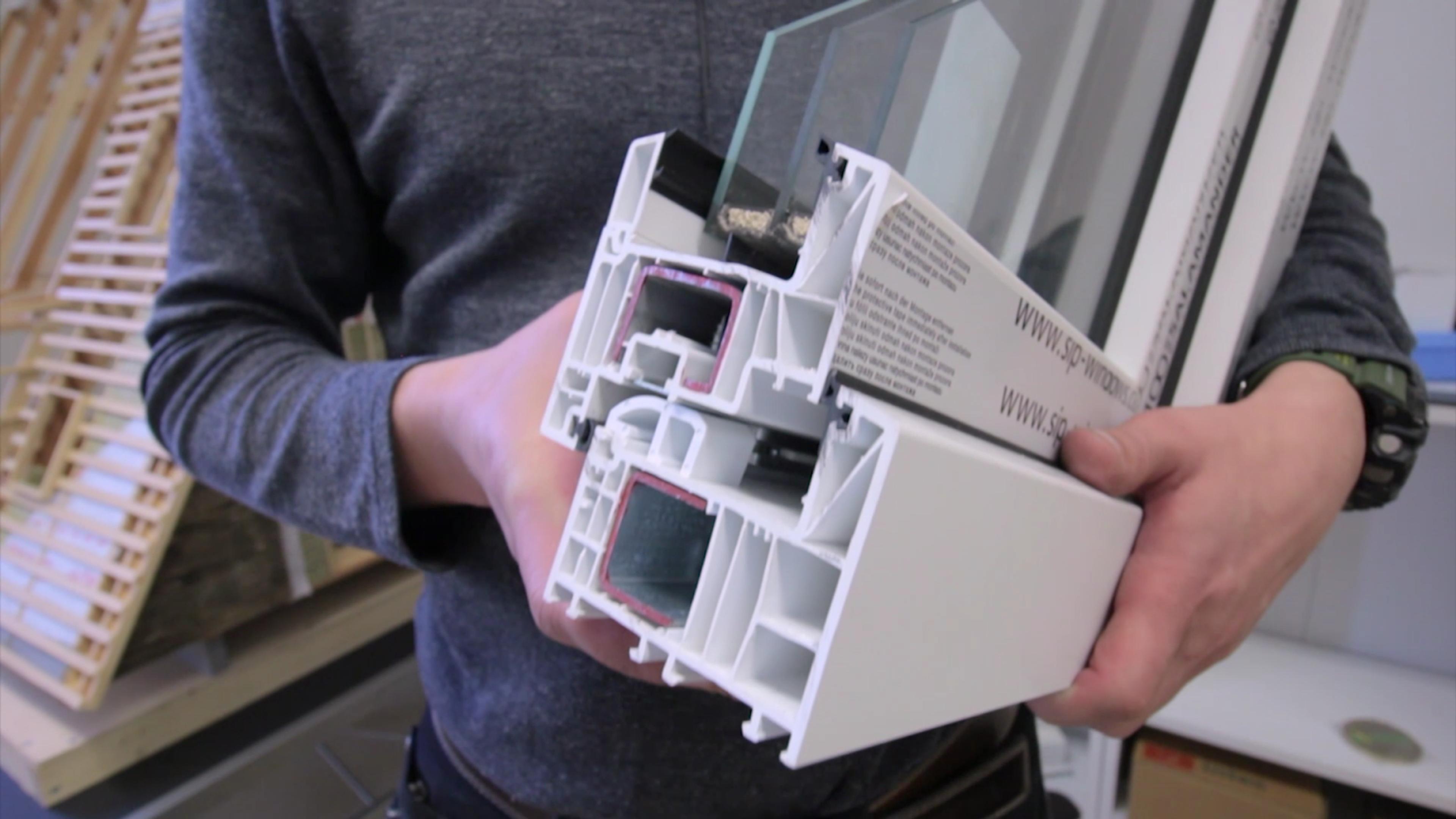 A high-performance triple-pane window profile is showcased here, demonstrating the level of insulation required for an A-frame home, which often features massive glass gables.