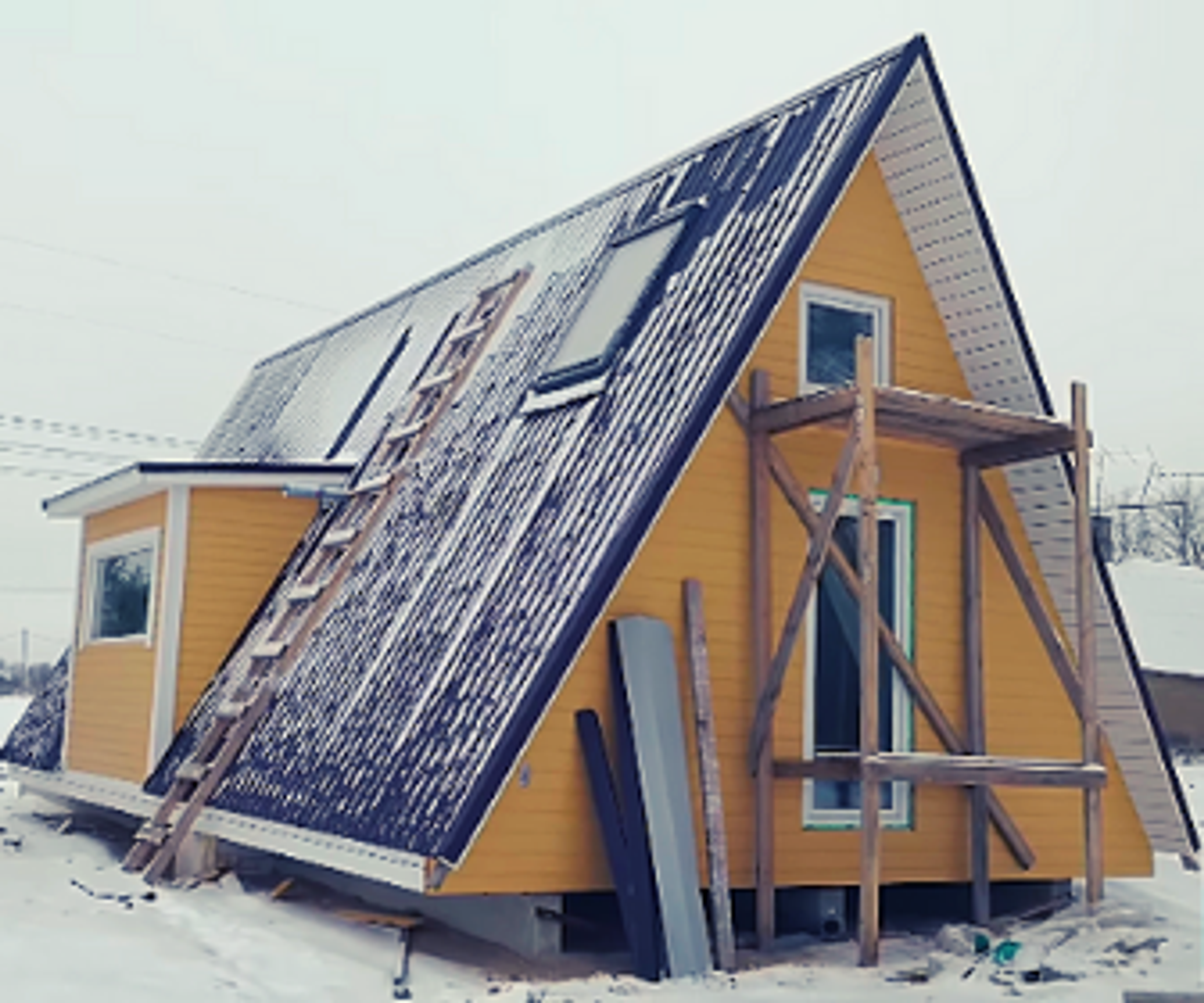 This photo shows a nearly finished Avrame Duo or Trio model, demonstrating the home's ability to handle harsh winter conditions while still under construction.