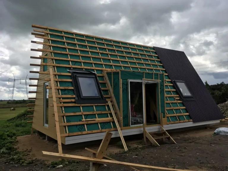 This photo captures a critical phase in an Avrame build—moving from the structural skeleton to a weather-tight shell.