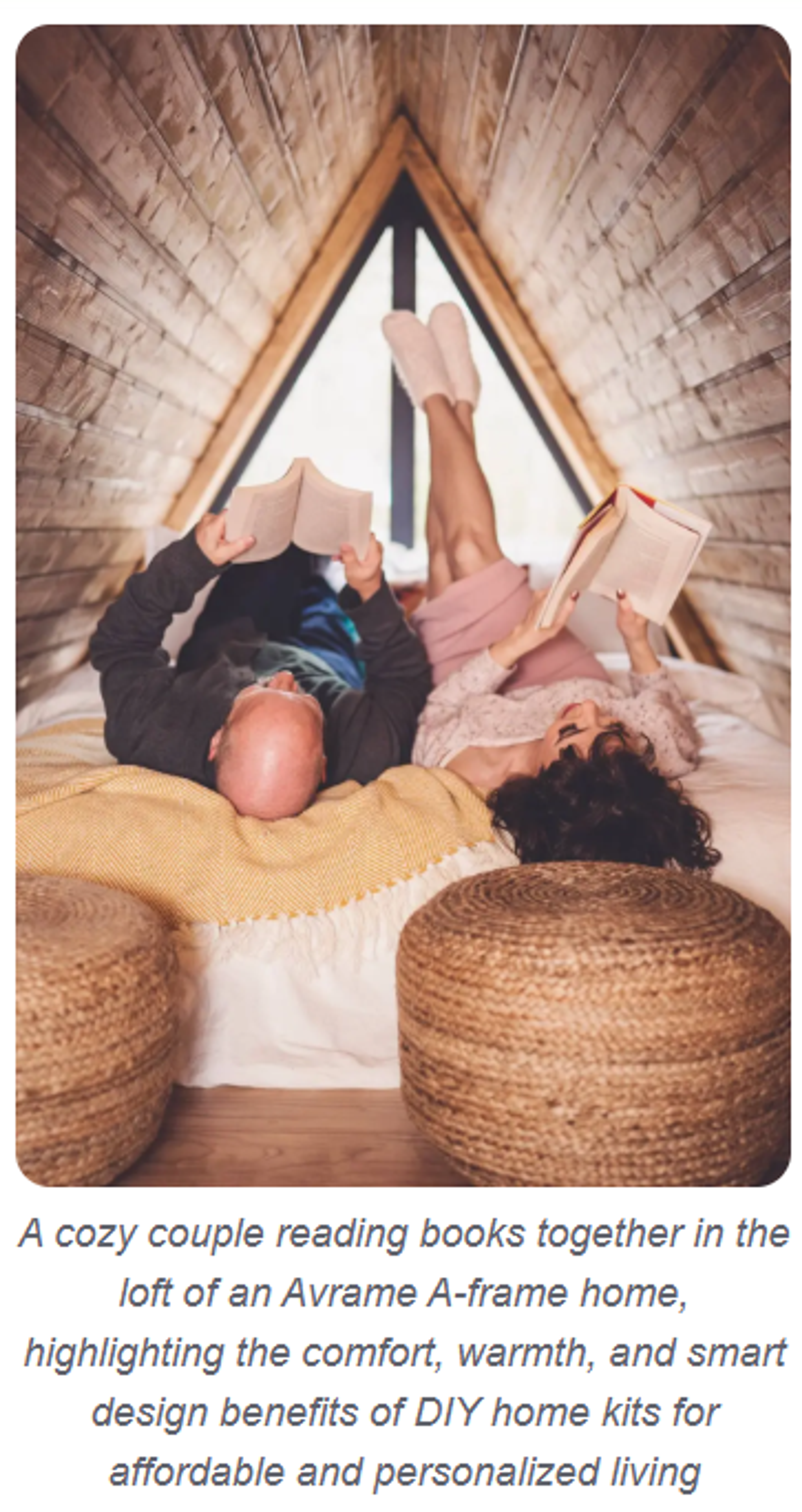 A couple relaxes and reads books together in a cozy, wood-paneled A-frame loft filled with soft blankets and rustic decor.