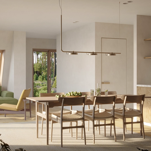This interior shot shows the ground floor living area of an Avrame Trio, showcasing a minimalist, Japandi-inspired aesthetic that emphasizes natural light and organic materials.