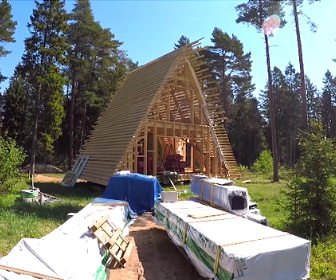 This photo captures a critical phase in the assembly of an Avrame kit home, where the skeleton of the structure is being enclosed. It perfectly illustrates the "Lego-for-adults" approach these kits take to construction.