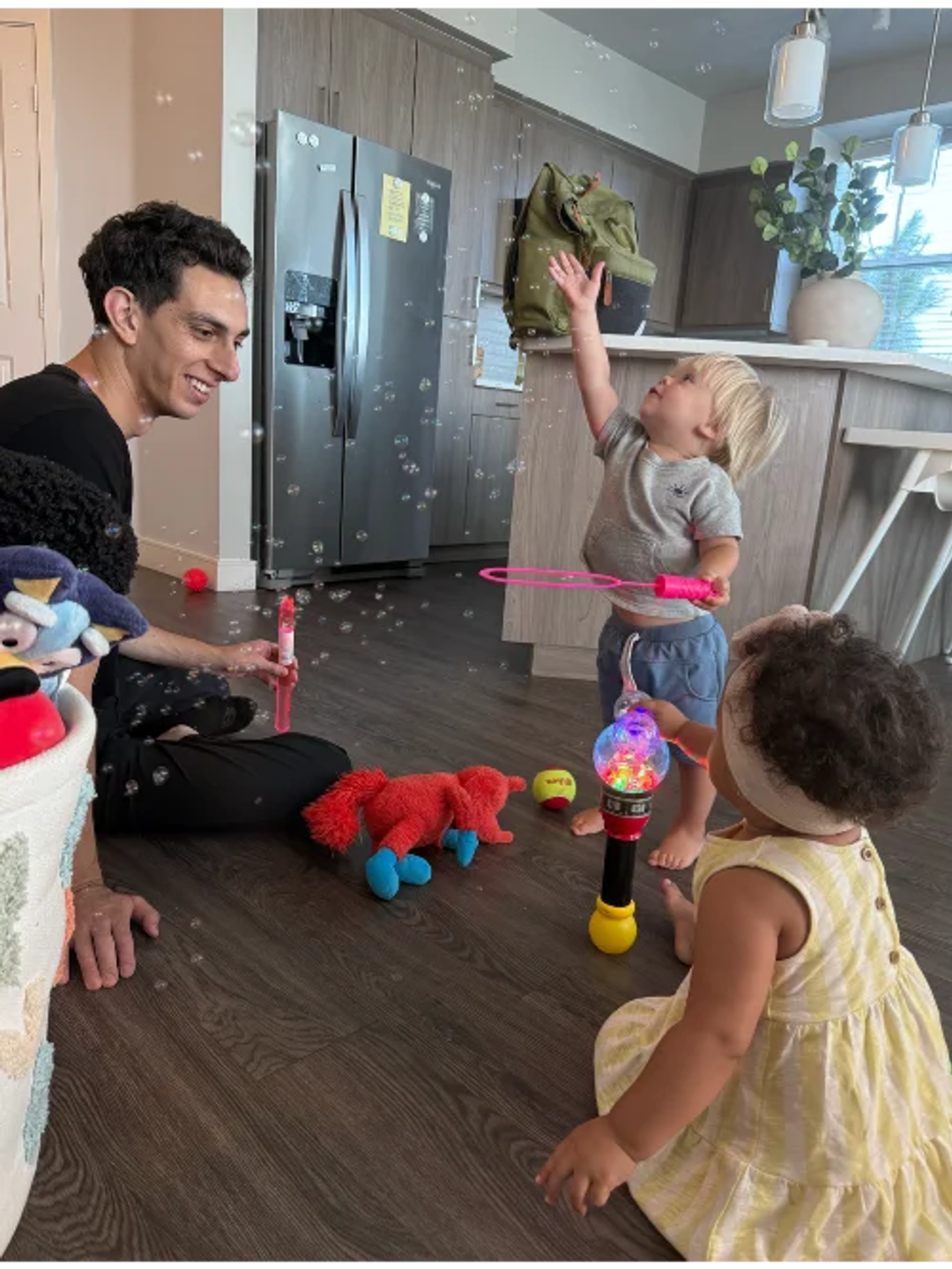 Children playing with educator