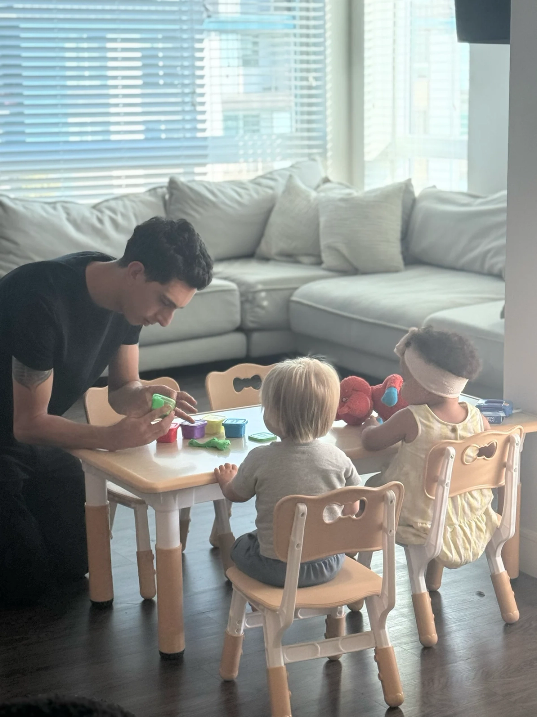 Educator engaging with children in learning activities