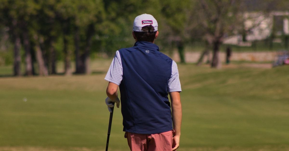 Golfer on the course assessing their performance and fitness level
