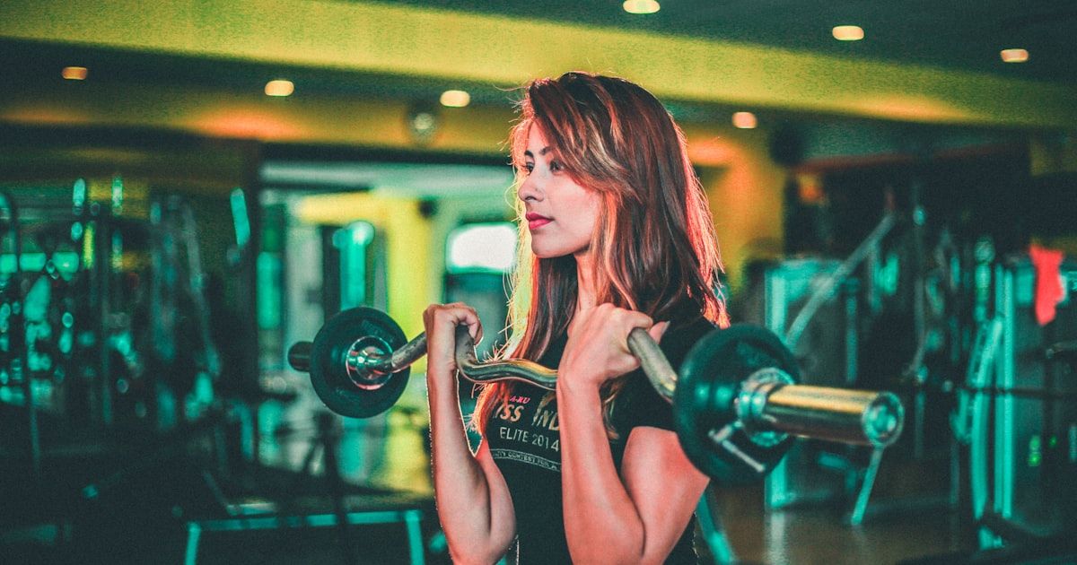 Athlete lifting a barbell during pre-season strength training