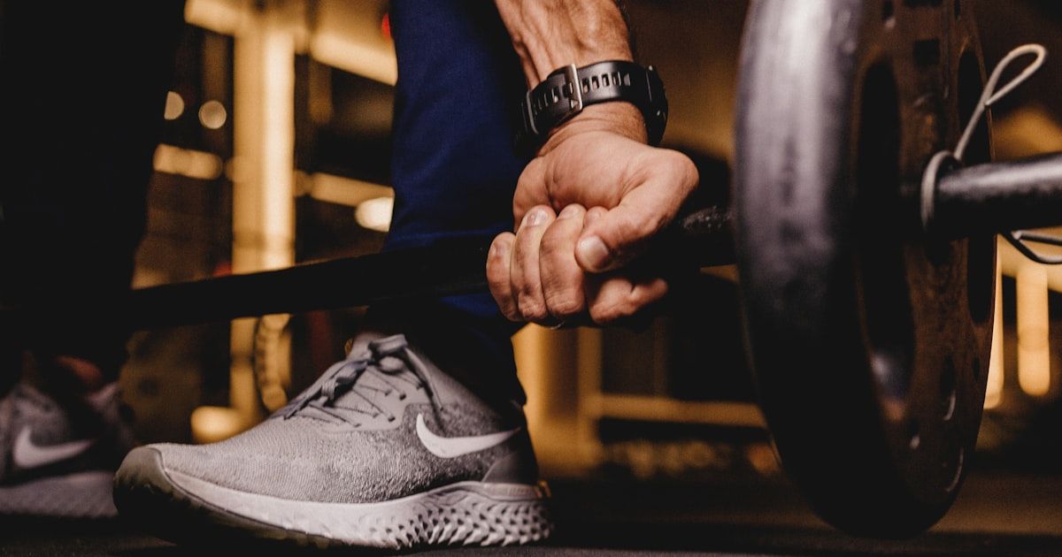 Athlete completing a structured training session in a gym, representing a daily golf WOD