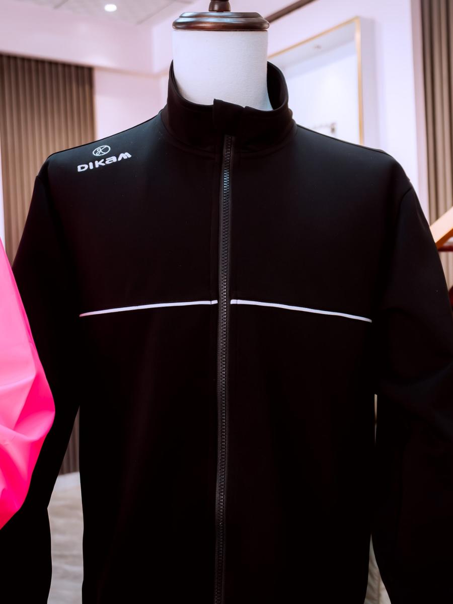 A black DIKAM track jacket with reflective piping
