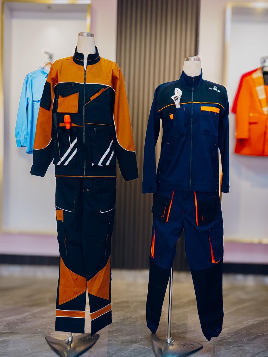 Hi-vis reflective work suits and DIKAM-branded workwear on mannequins