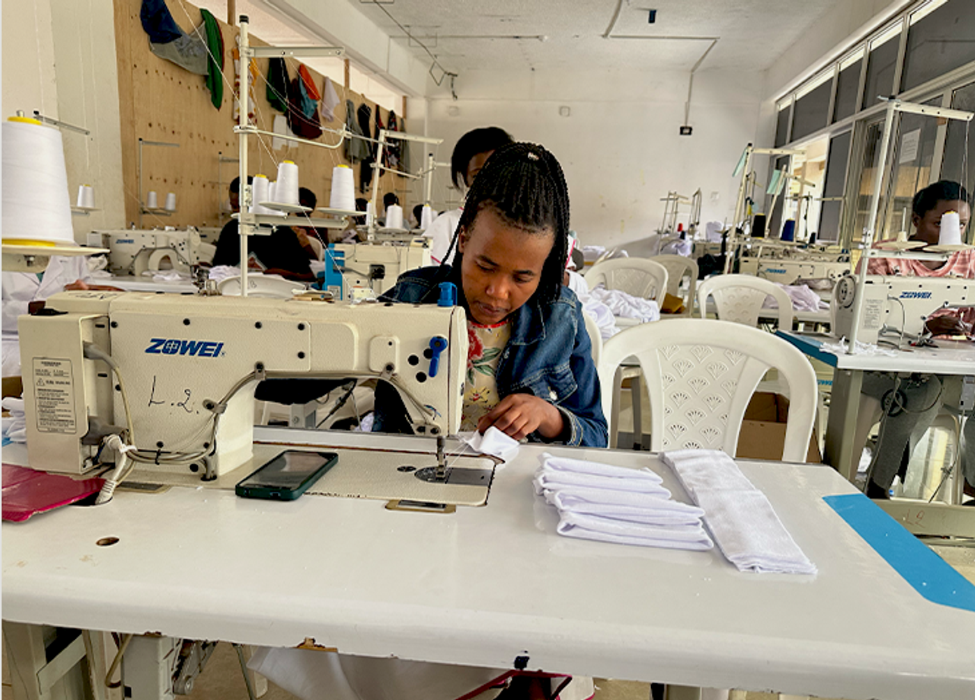 Trainees at work on sewing machines at the DIKAM Training Center