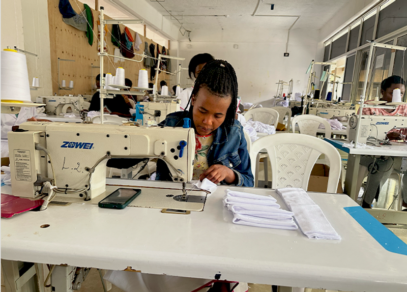 Trainees at work on sewing machines at the DIKAM Training Center