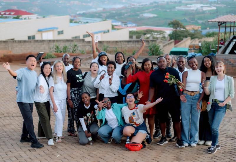 The Africa's Business Heroes delegation and the DIKAM team at the factory site above Kigali