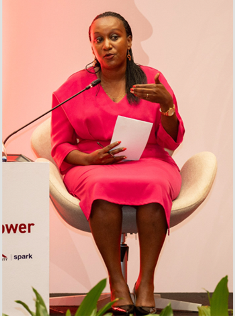 Diane Mukasahaha speaking on a business conference panel