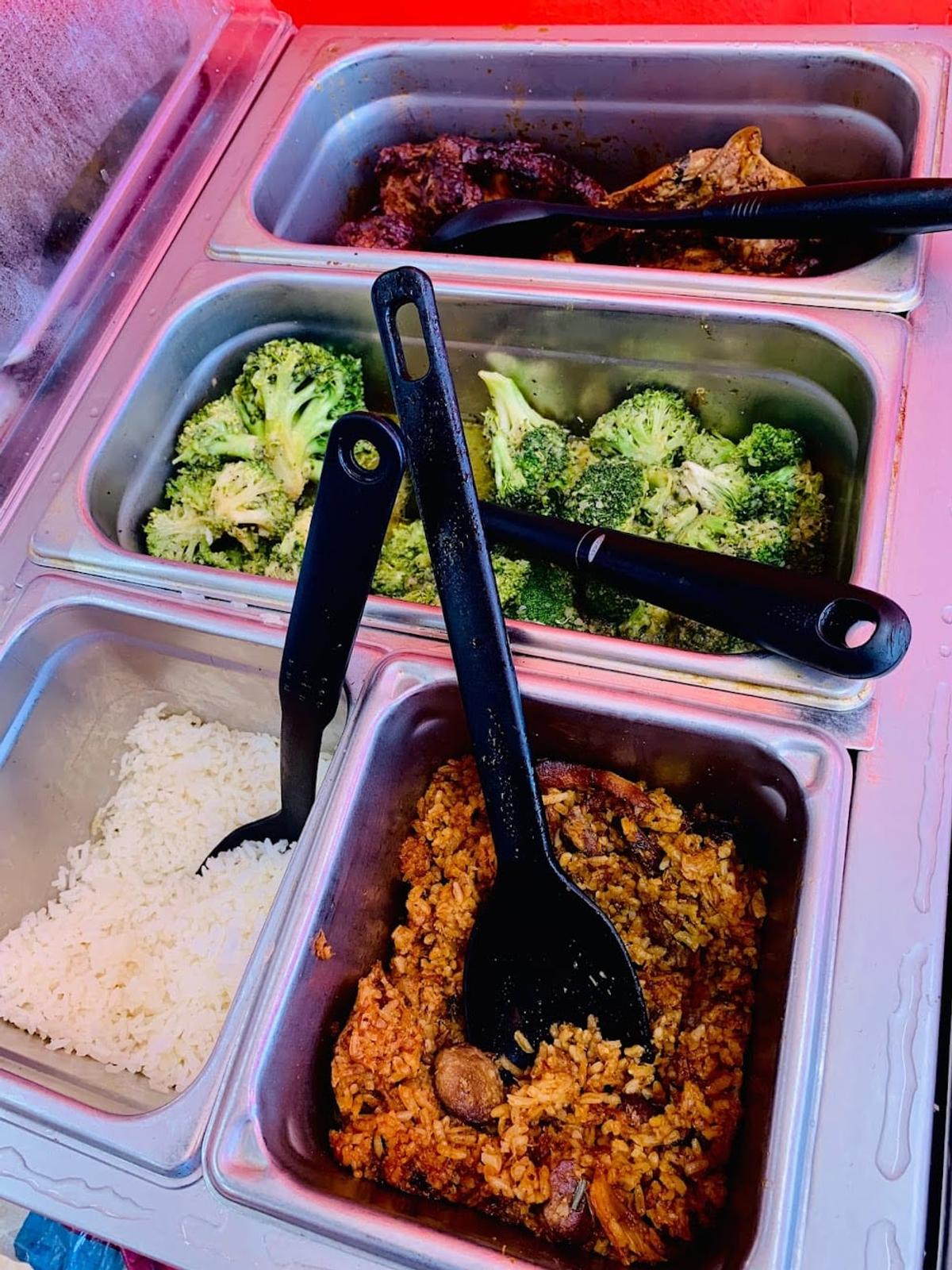 Zion Delight soul food buffet line with broccoli, rice and dirty rice — self-serve restaurant Atlanta