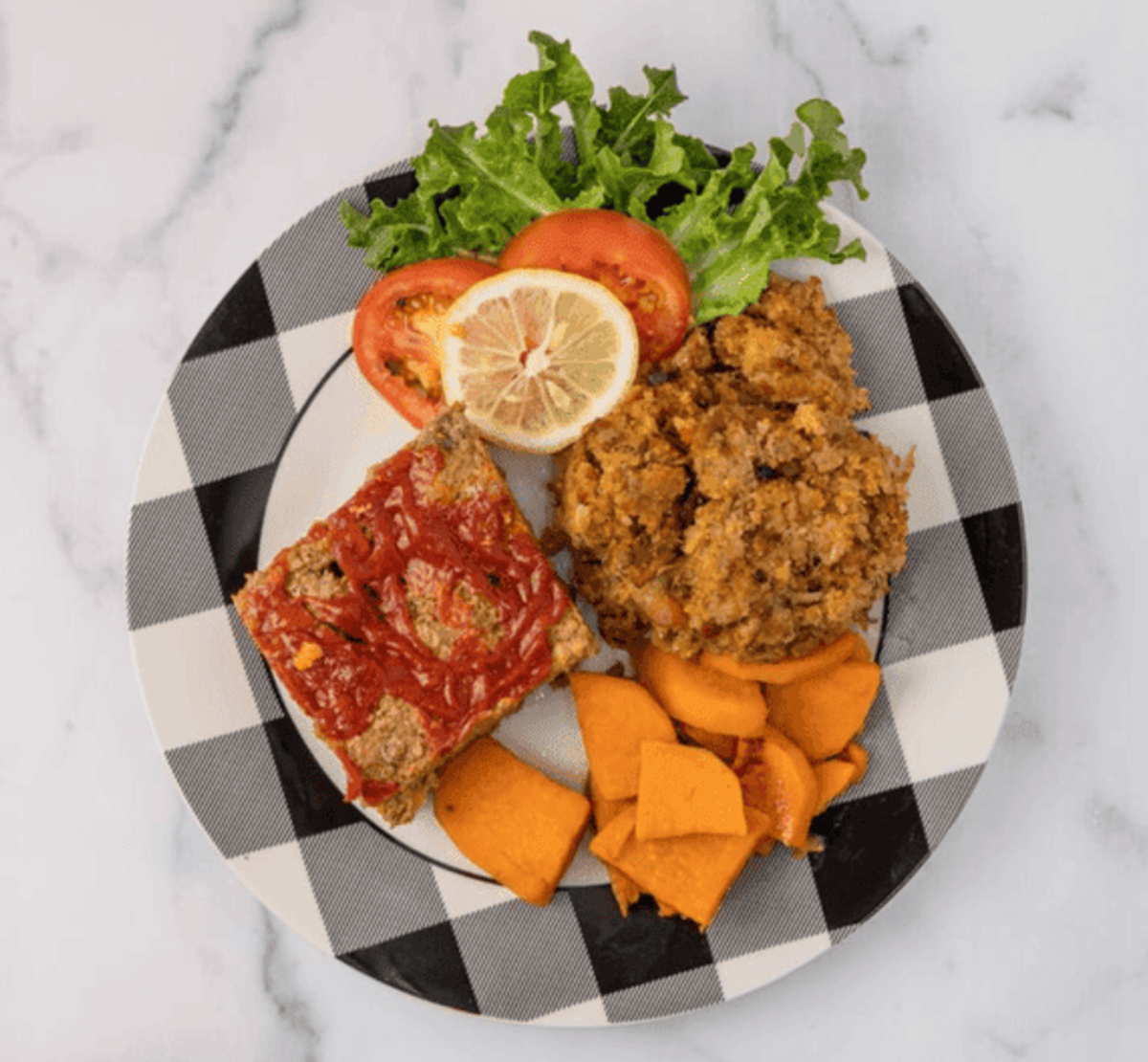 Zion Delight meatloaf and fried chicken with candied yams — Atlanta soul food plate